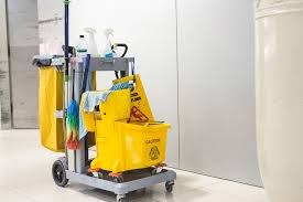 Janitorial cart with mop bucket in a facility
